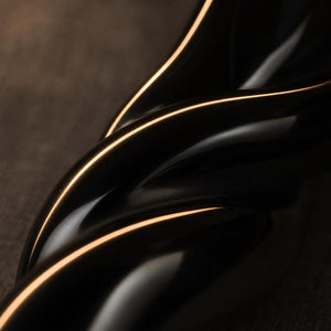 Macro close-up of the polished spiral groove of The Obsidian Bar