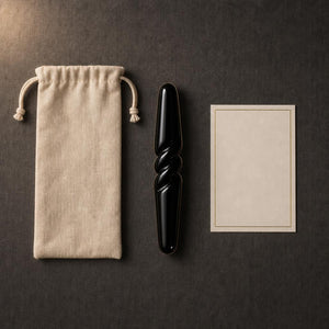 Everything that arrives: the obsidian bar, its linen pouch and a card